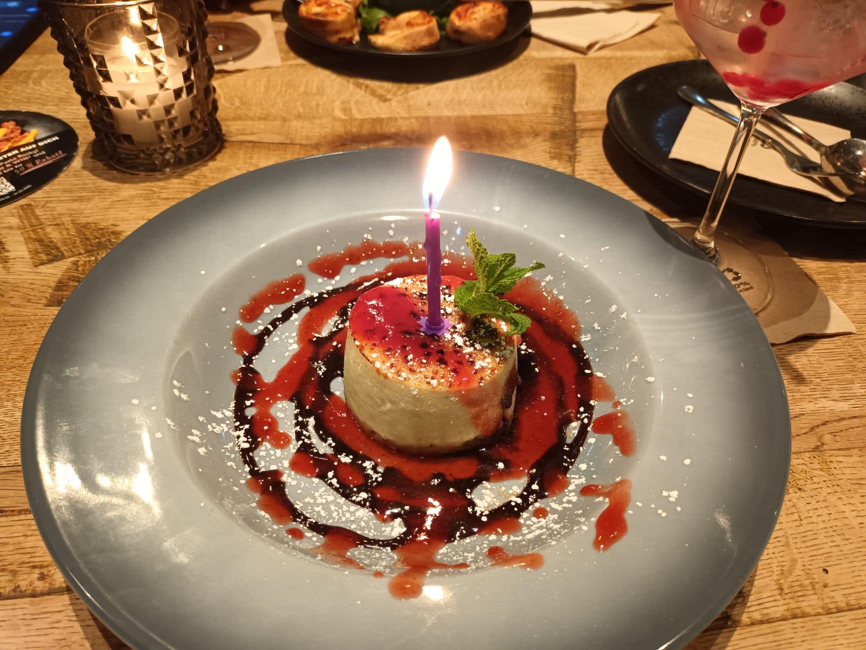 Elegant dessert with a lit candle for a special celebration.